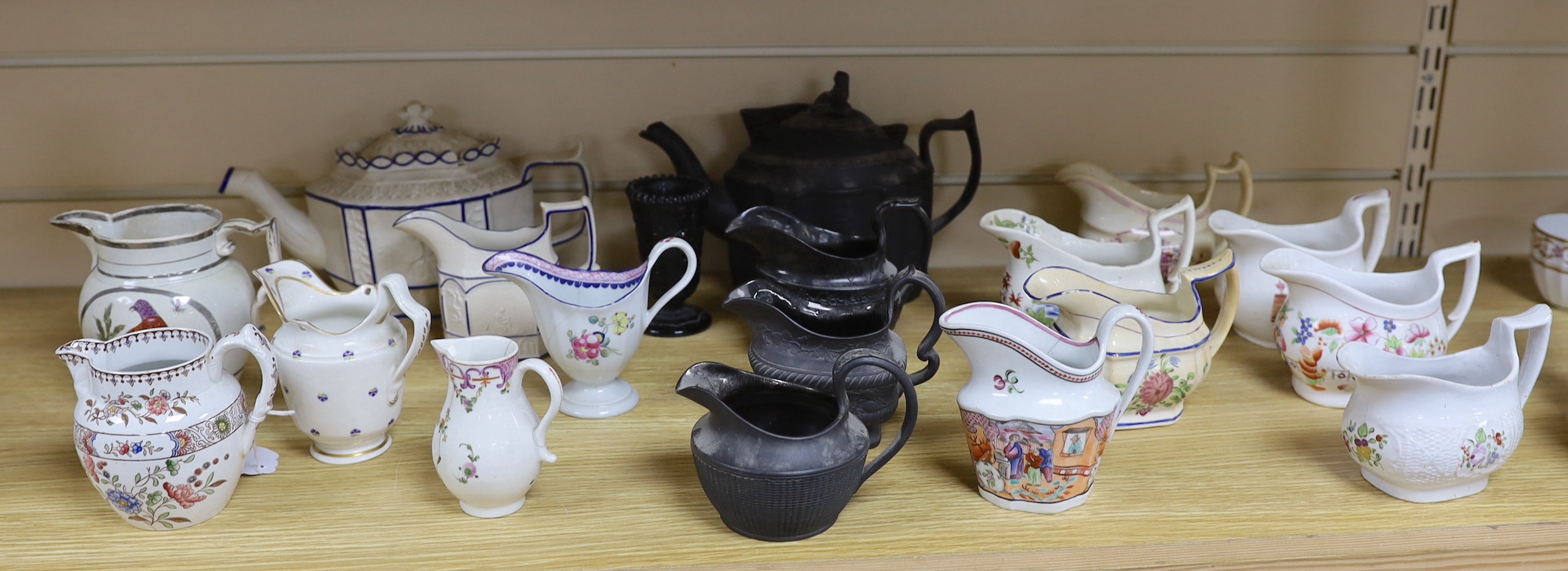 A collection of Regency stoneware and porcelain tea wares, including a small collection of black basalt, Castleford type etc. tallest teapot 17cm high